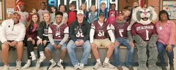 Sherman ISD Football team with students